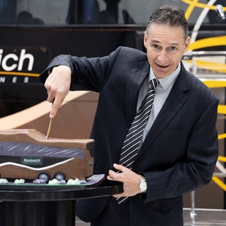 Former CEO Bernard Pavlovich cutting the cake